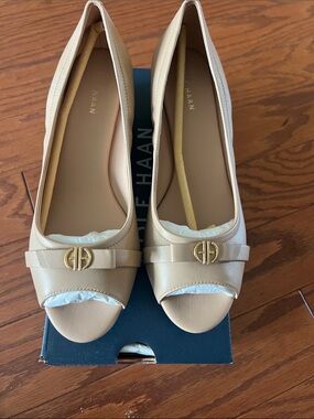 Never Worn Cole Haan Nude Leather wedges with Gold Logo Accent!